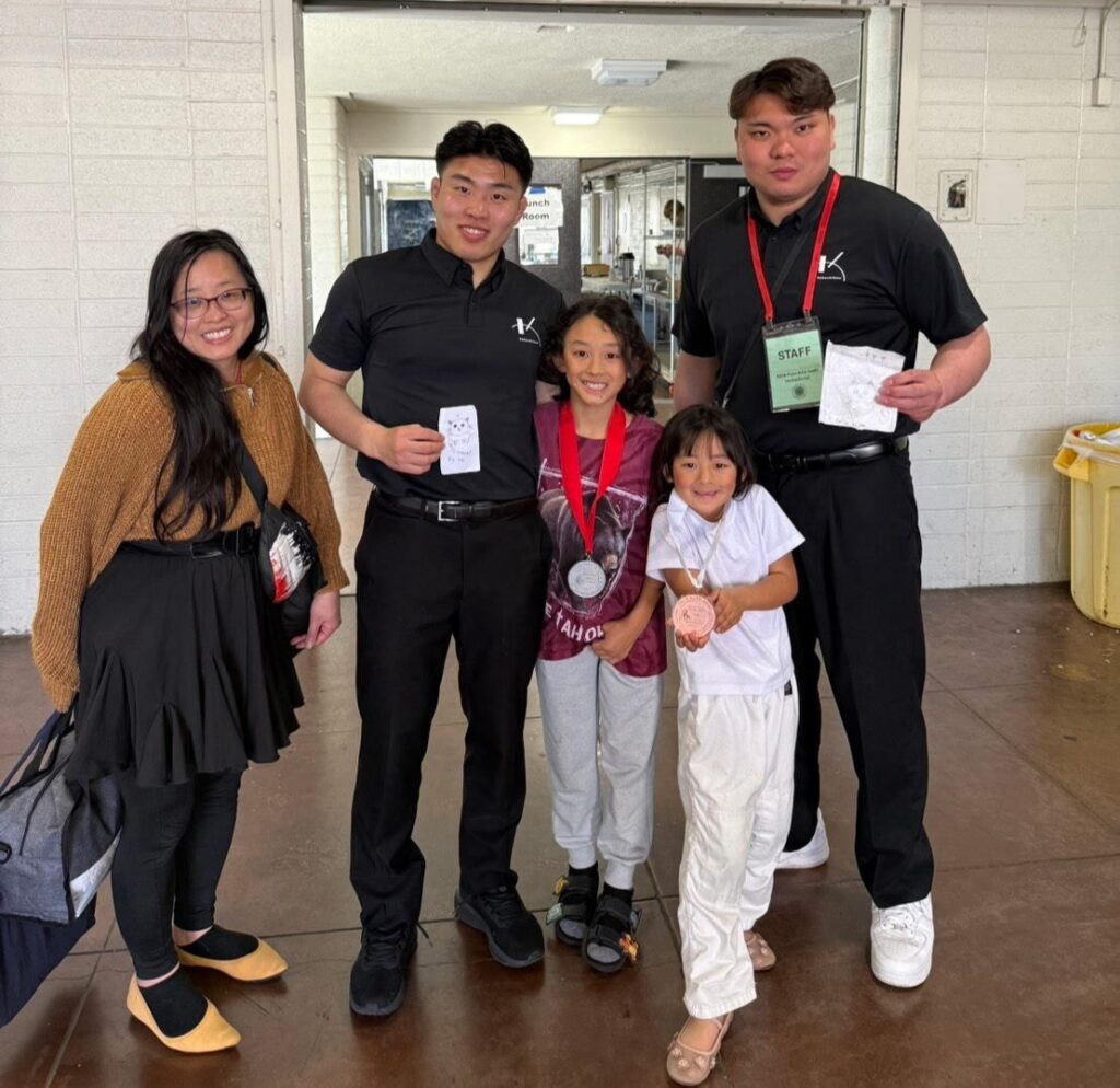 Hiroshi, Mei and their mom Erin with their Kokushikan judo friends who they will meet in